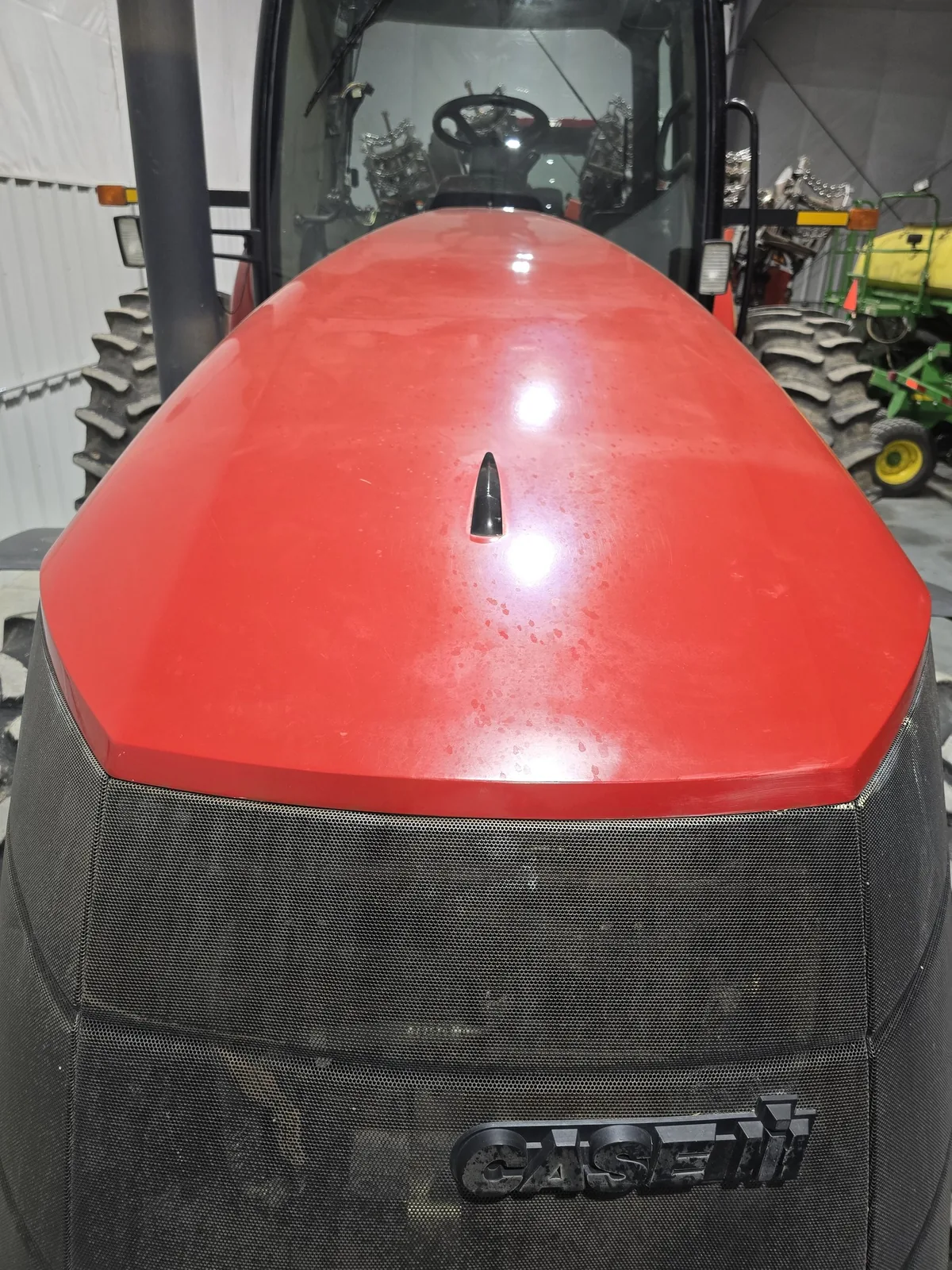 Before view of oxidized Case IH Magnum 275 hood